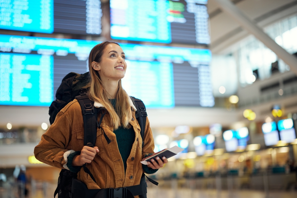 Woman checking her flight on airport