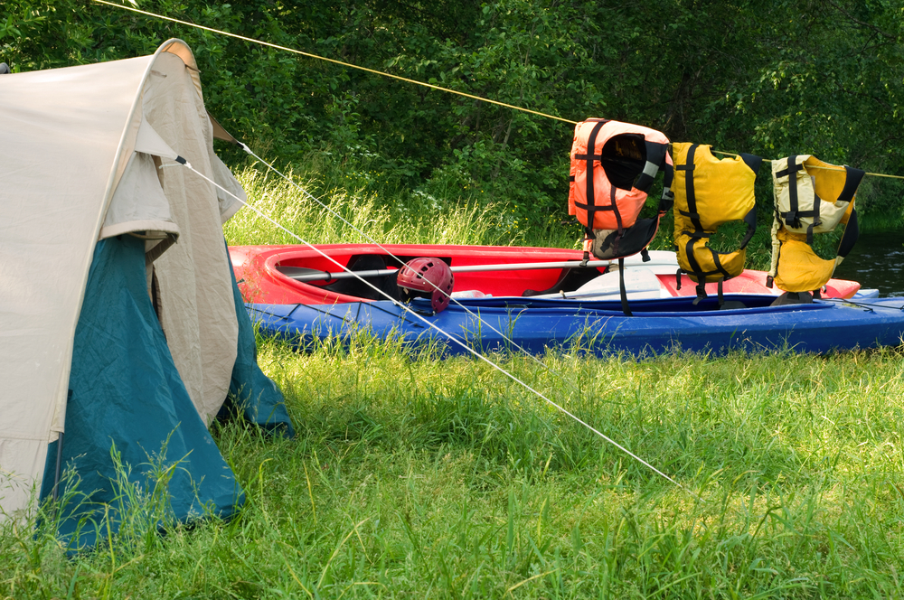 Campsitewith kayaks near river