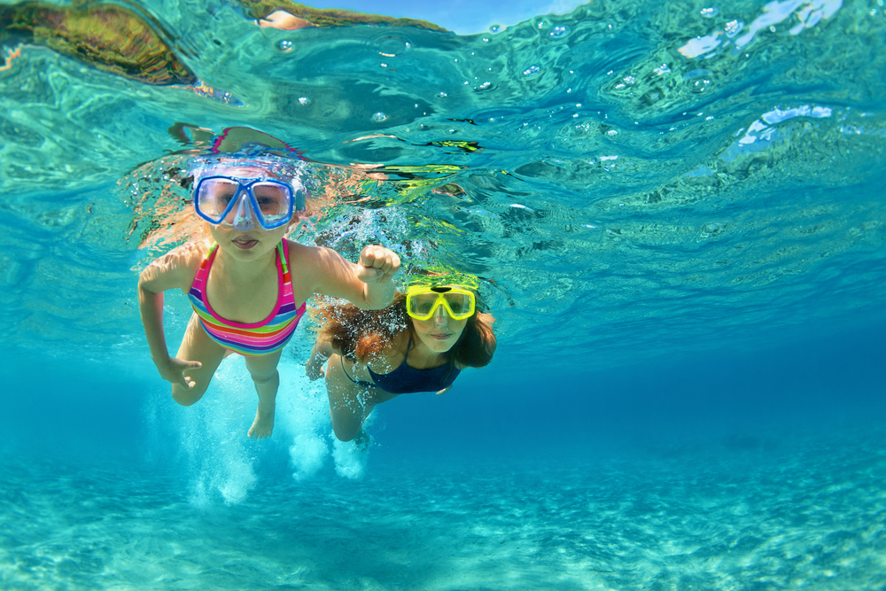 Mother and daughter enjoy snorkeling