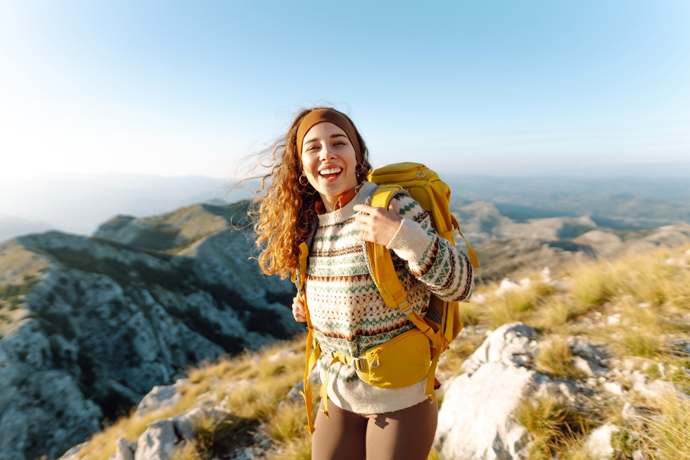 Backpacker hiking and enjoys the landscape